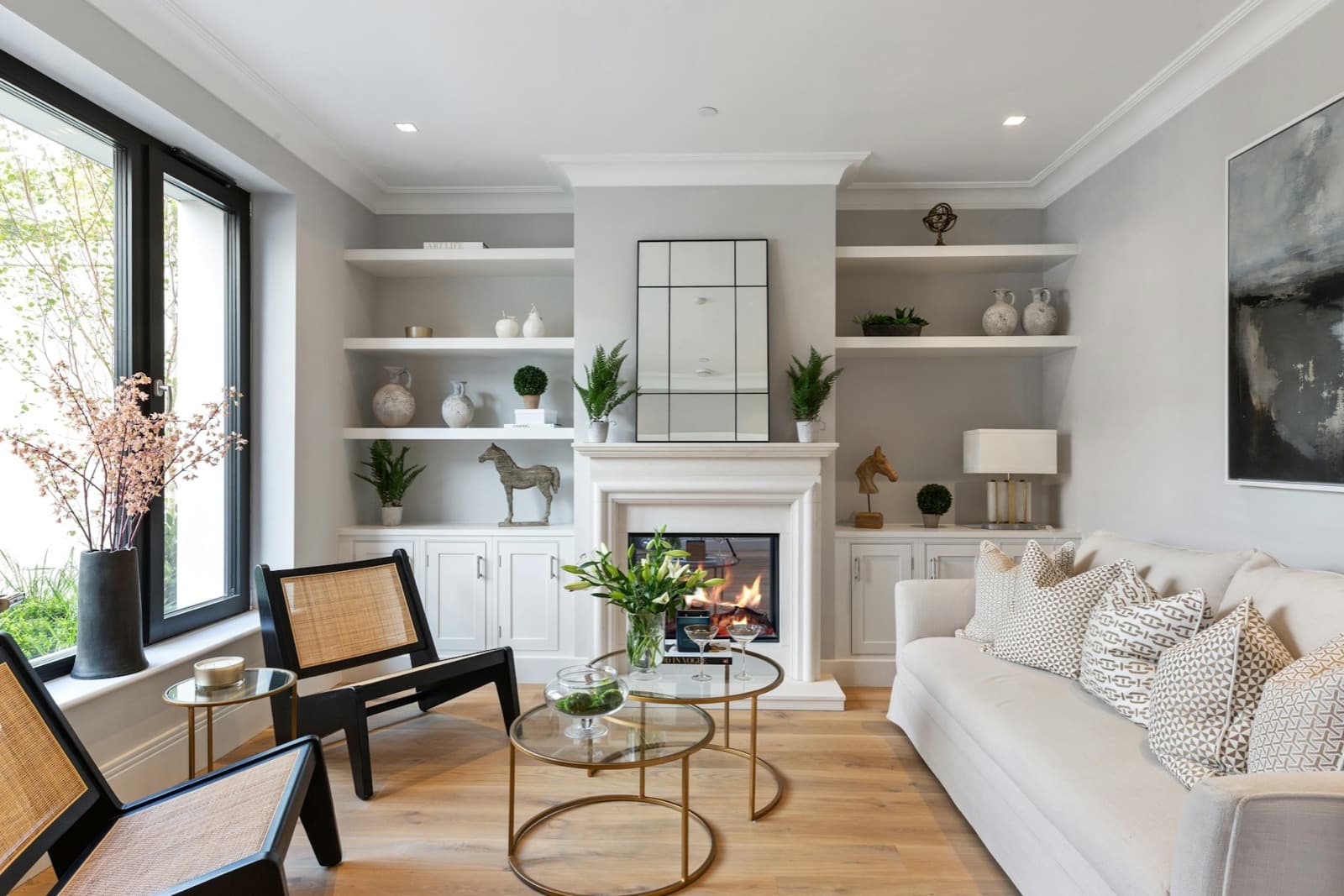 Neutral living room with a fireplace and a white sofa