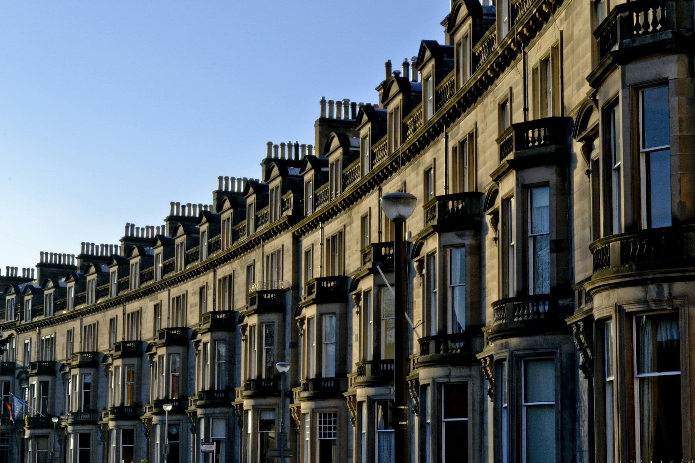 Curved sandstone terrace with bay windows in Edinburgh