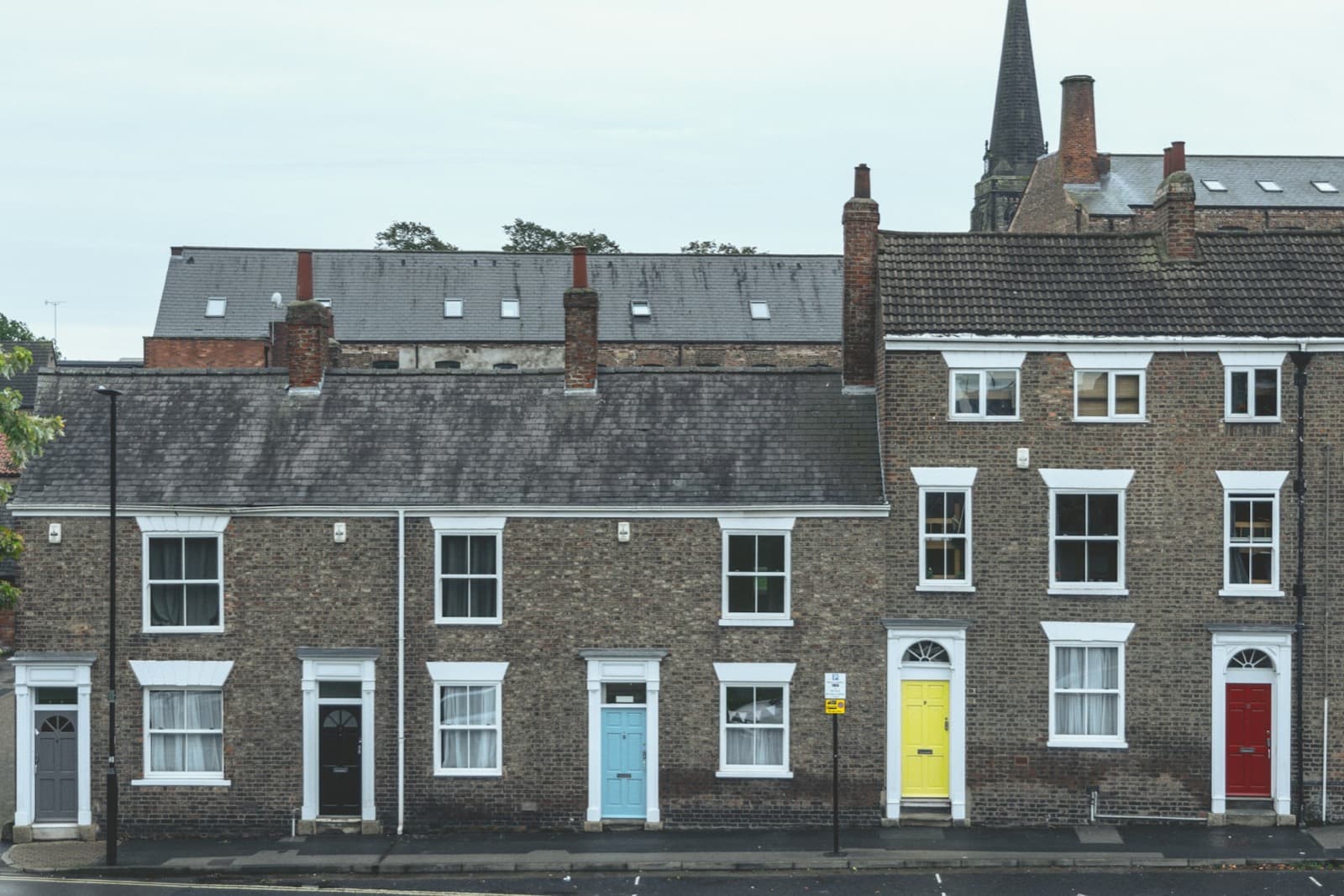Brick terraced houses with brightly painted front doors